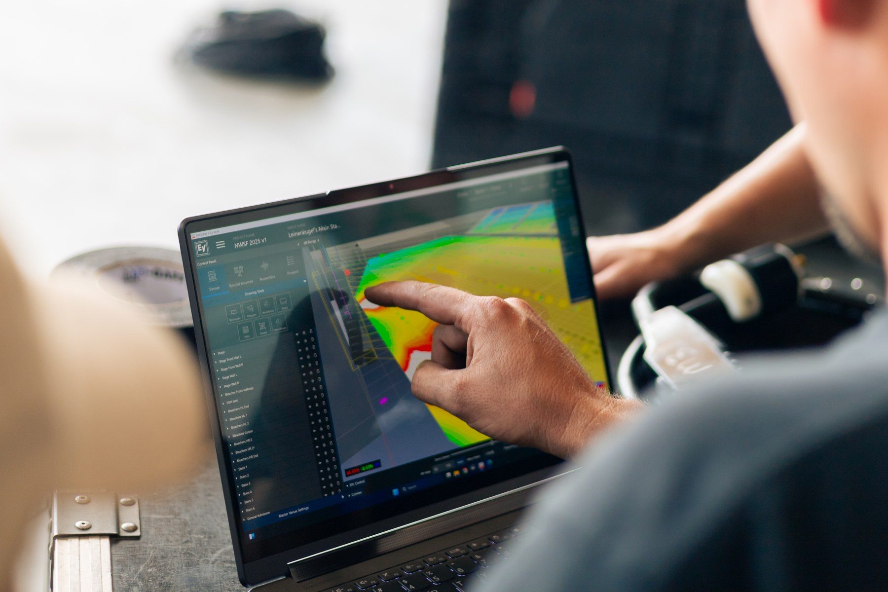 On-site review of the acoustic coverage model on a laptop